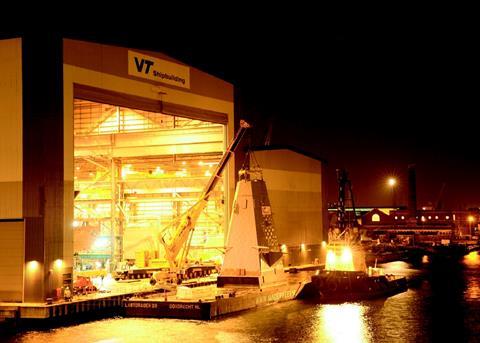 The HMS Daring foremast is loaded onto a barge at VT Shipbuildings Portsmouth facility.