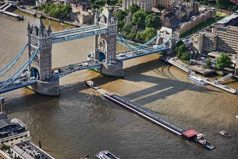 Livett's tugs guide the barge through  London's Tower Bridge (Livett's Group)