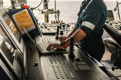 Marine Navigation Officer using laptop